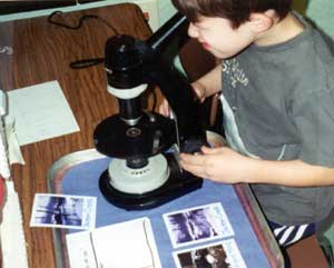 looking into a microscope